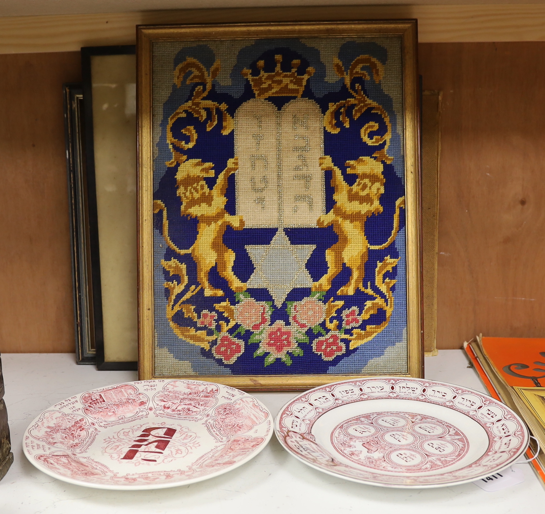 Judaica - two 1920's Ridgways pottery Passover plates, a needlepoint picture and two prints